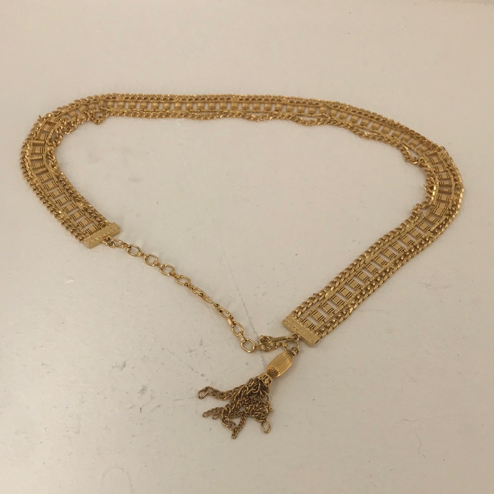 Gold metal belt with tassel clasp